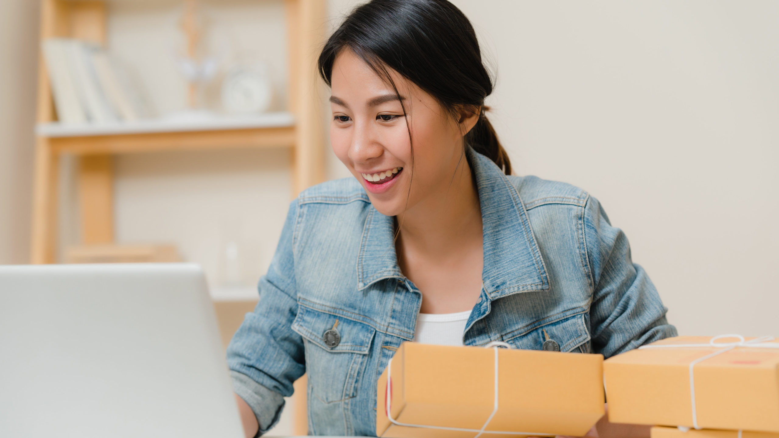 Business owner reviewing digital work on a laptop without text overlay